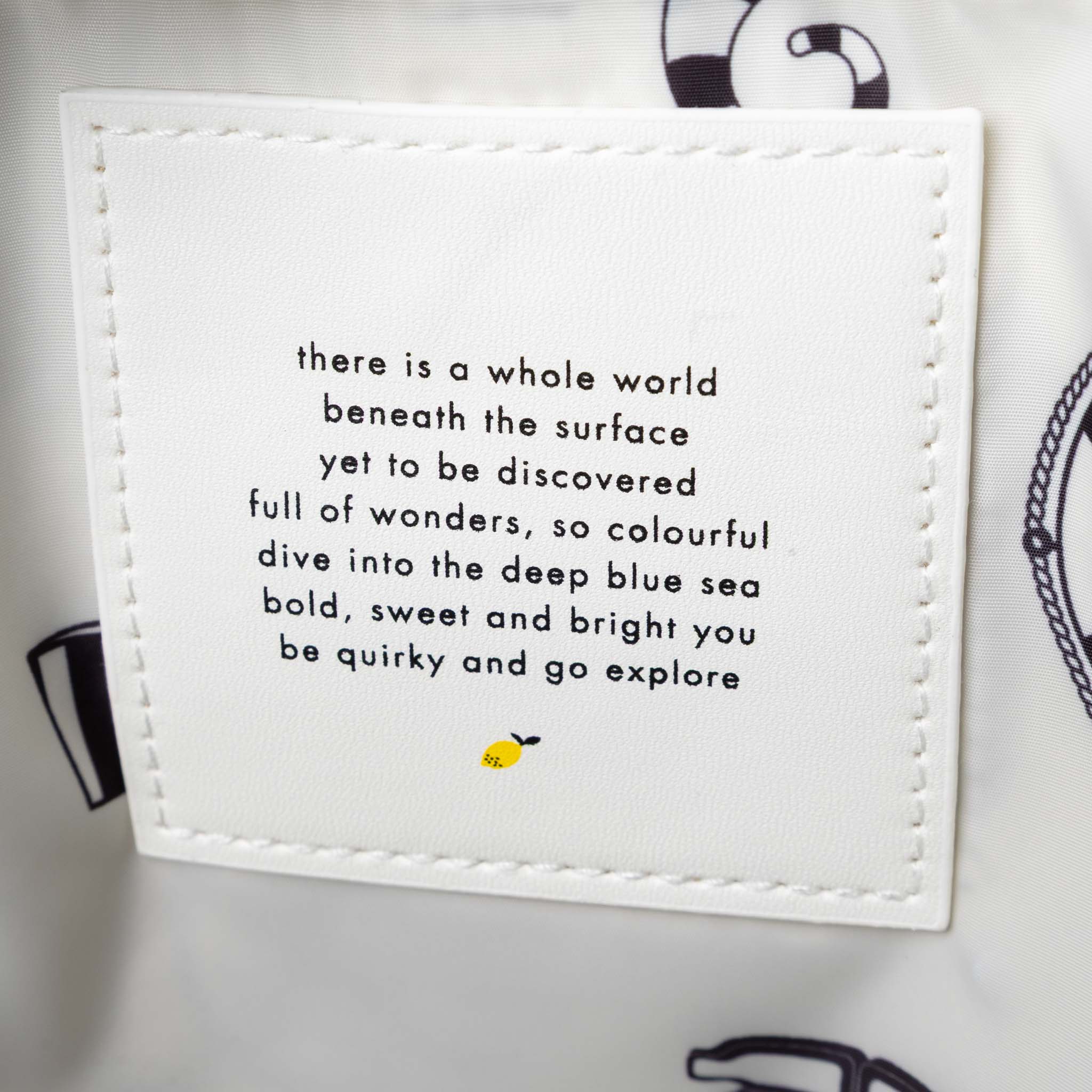 recycled-wonders-envelope-backpack-large-aquamarine-Blue-backpack-with-yellow -lightblue-accents-and-orange-striped-straps-interior-quote