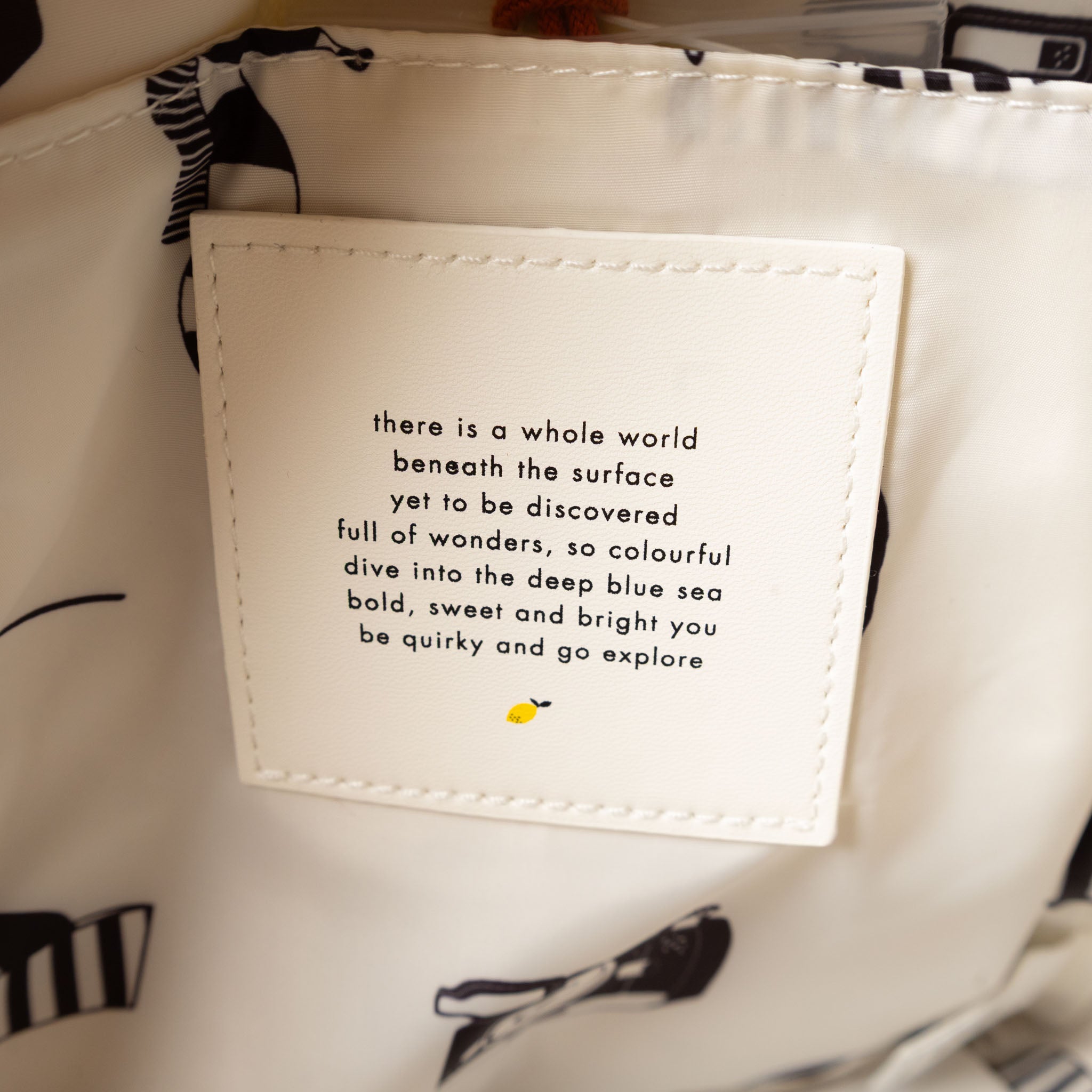 recycled-wonders-envelope-backpack-small-lifeguard-red-with-striped-red-straps-interior-quote