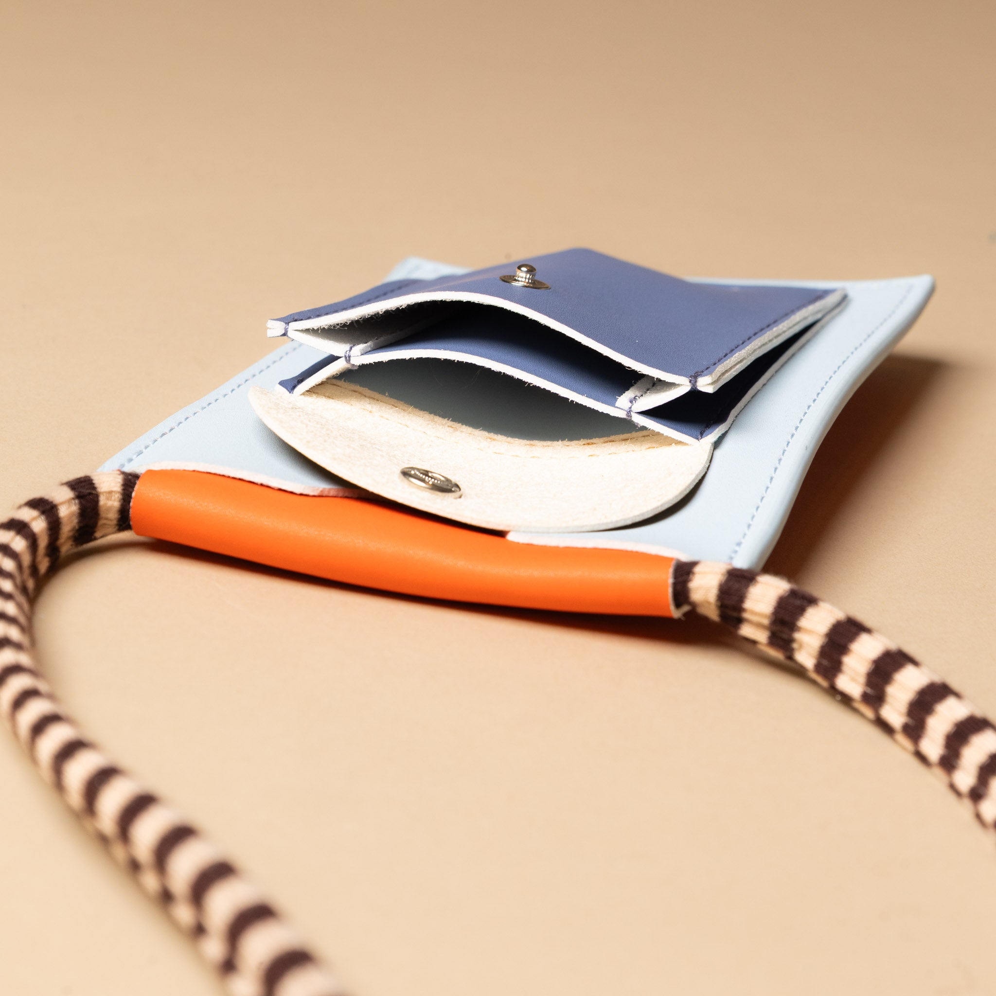 recycled-wonders-phone-pouch-blue-whale-with-black-and-tan-striped-strap-front-pocket-open