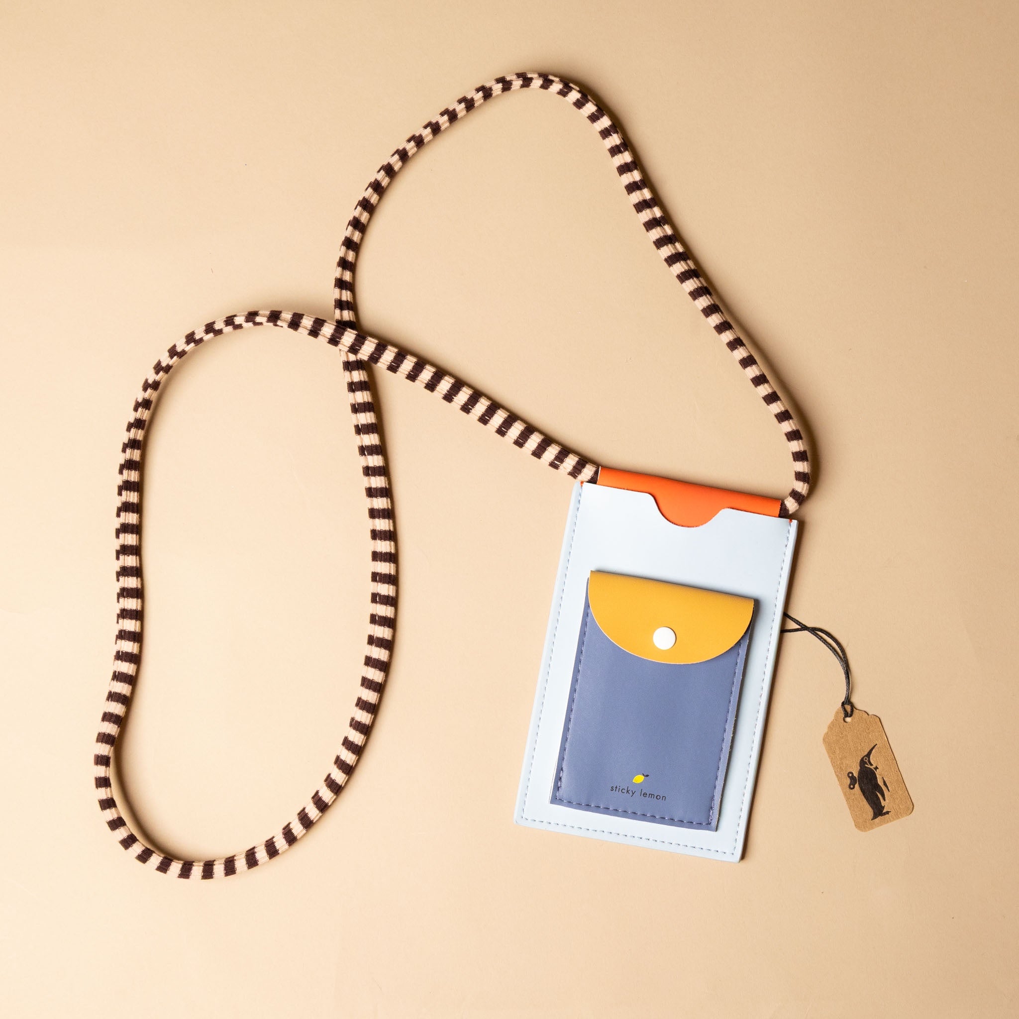 recycled-wonders-phone-pouch-blue-whale-with-black-and-tan-striped-strap