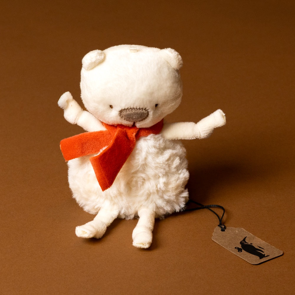 White troly-poly-polar-bear-bo with a red bow tie on a brown background