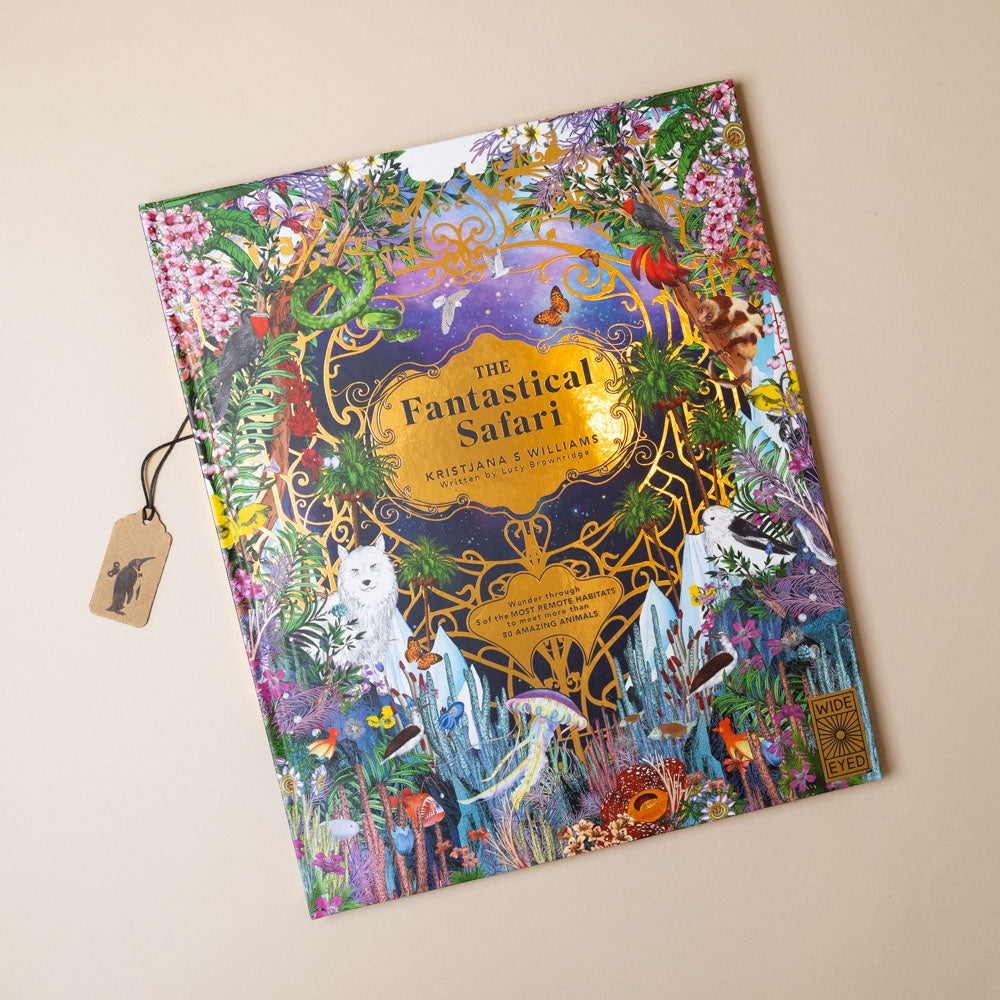 Colorful book titled 'The Fantastical Safari' with animal illustrations and gold-foil detail on a beige background