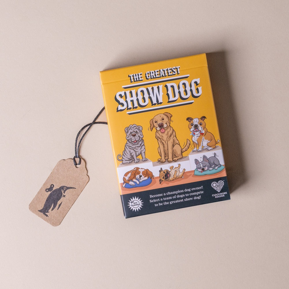 Board game box titled 'The Greatest Show Dog' with illustrations of dogs on a beige background