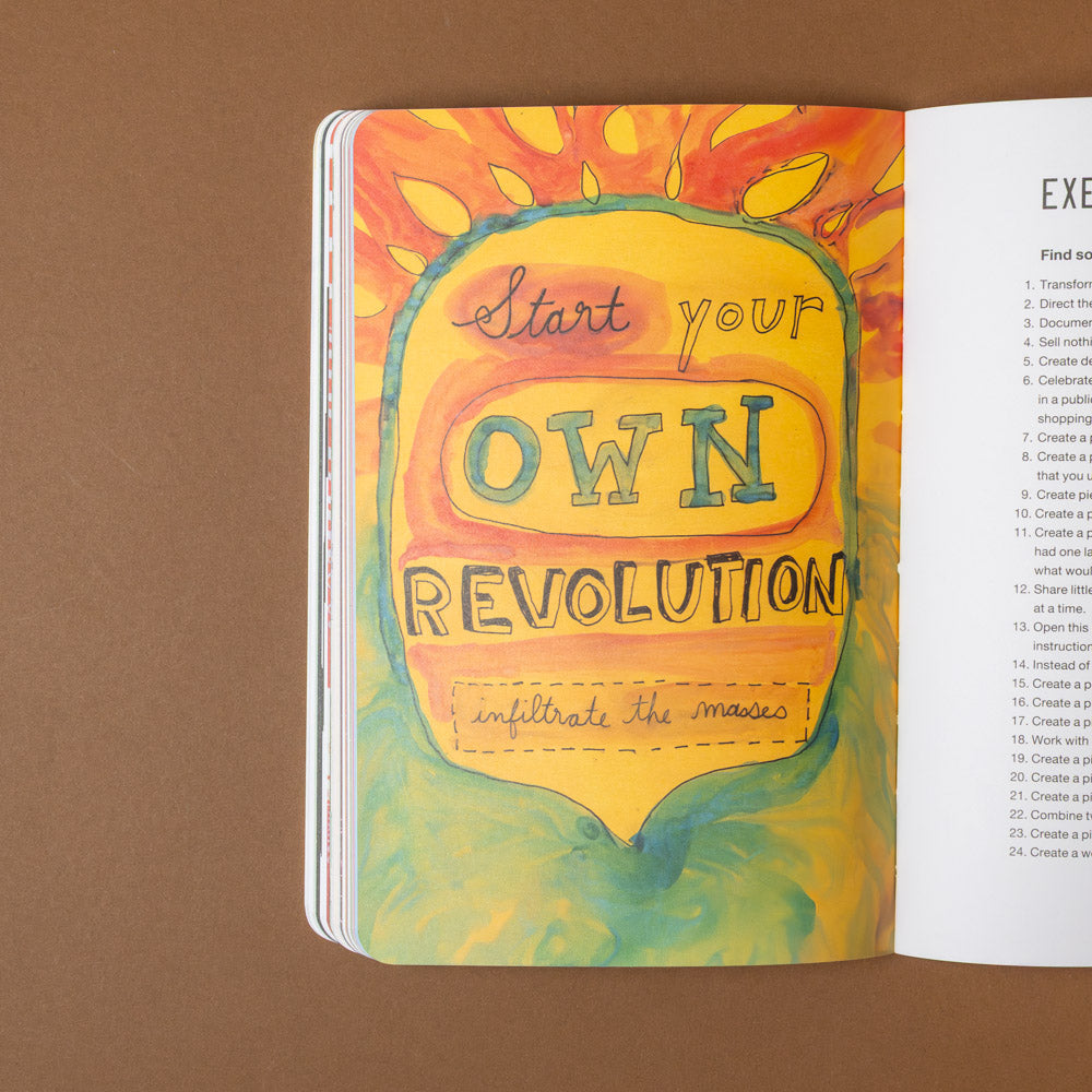 the-guerilla-art-guide Open book with colorful illustration and text 'Start your own revolution' on a brown background