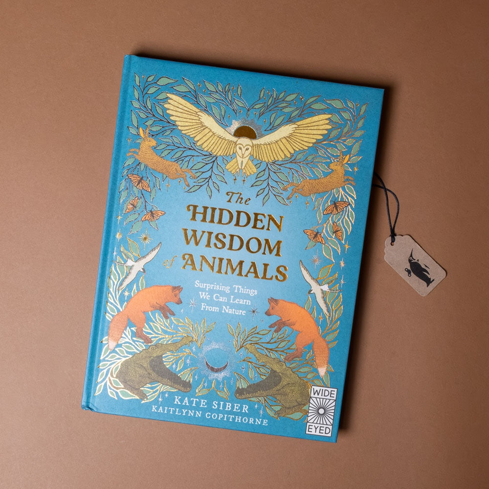 Book titled 'The Hidden Wisdom of Animals' with animal illustrations on a brown background