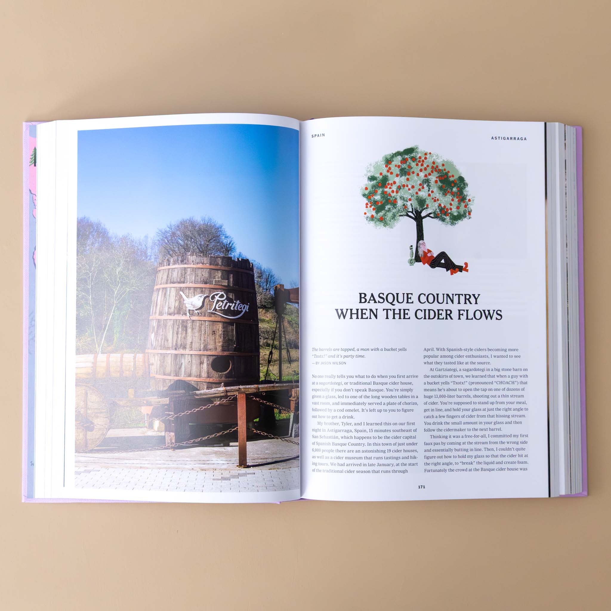 the-new-york-times-cultured-traveler-section-titled-basque-country-where-the-cider-flows-with-text-picture-of-a-large-barrel