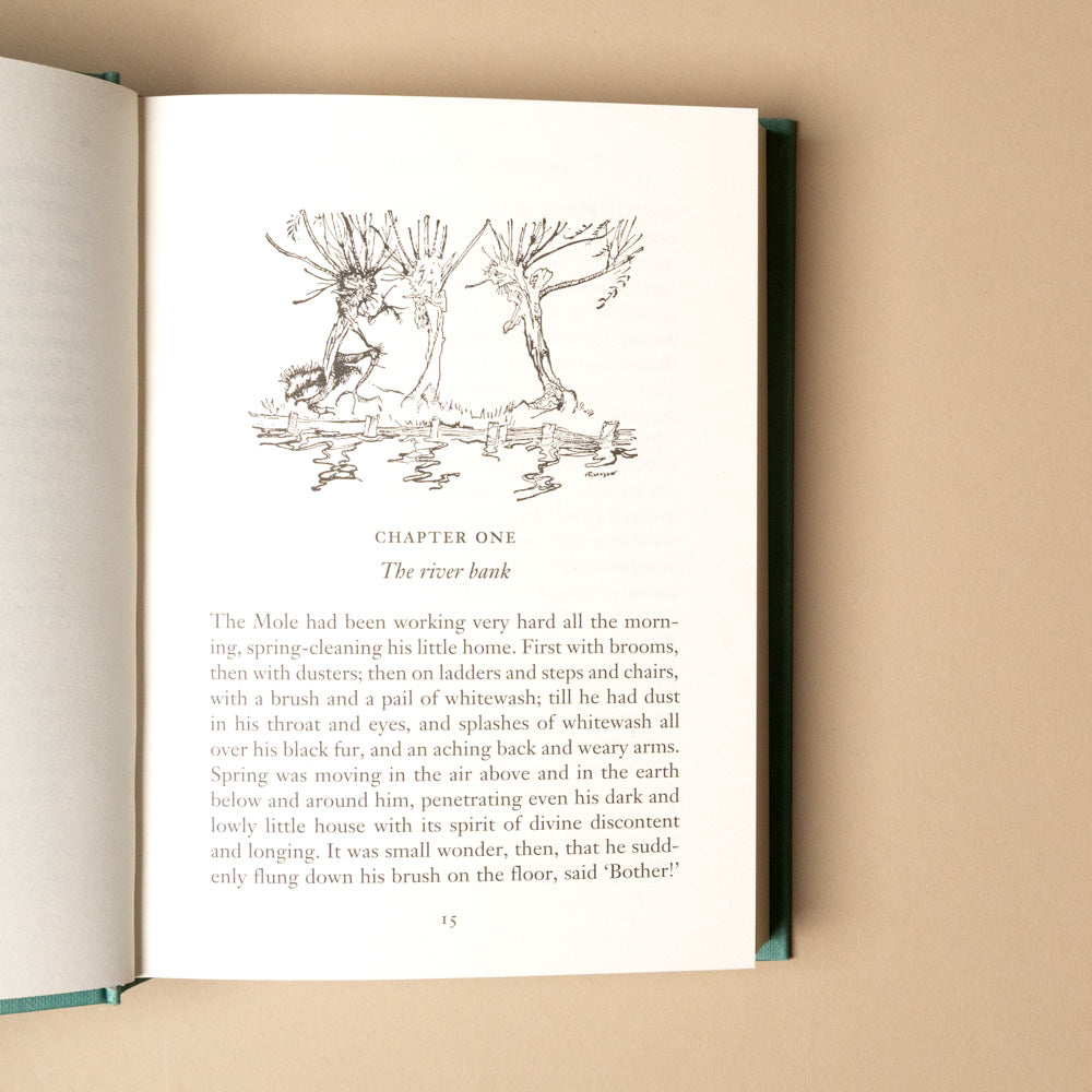the-wind-in-the-willows Open book with a chapter illustration on a beige background