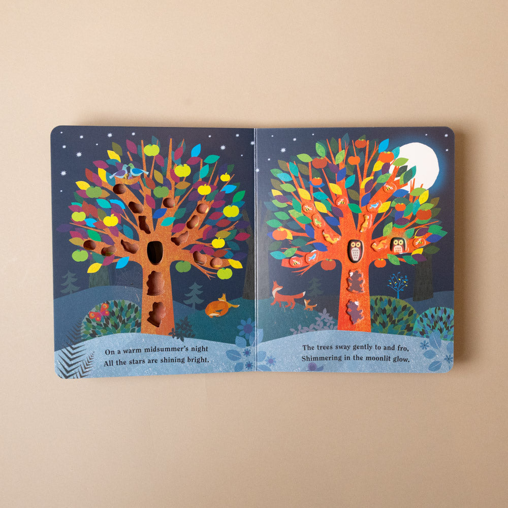 tree-a-peek-through-board-book Colorful tree illustration on a book page with a beige background