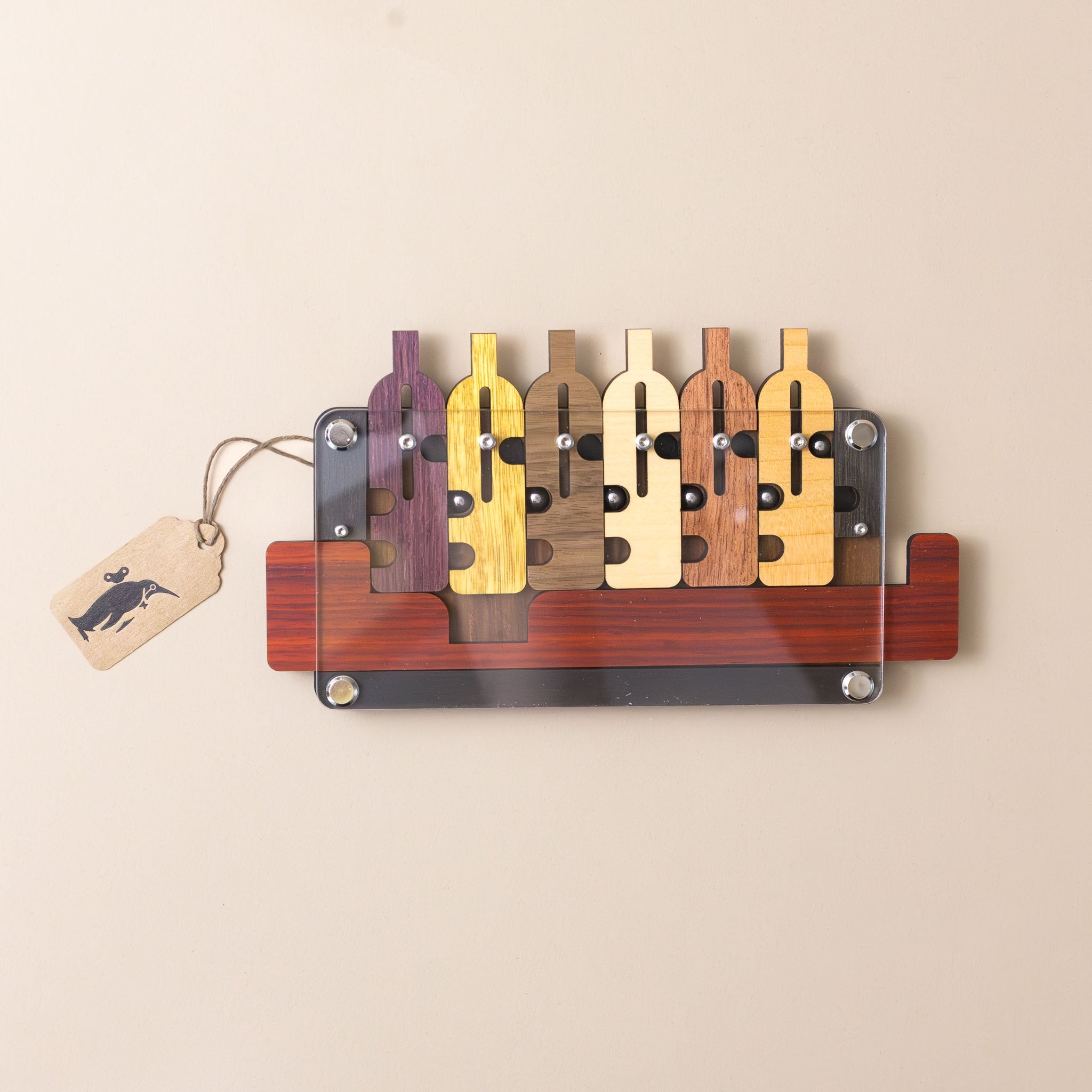 wooden-bottles-up-puzzle-various-wood-colors-with-metal-balls-and-acrylic-barrier