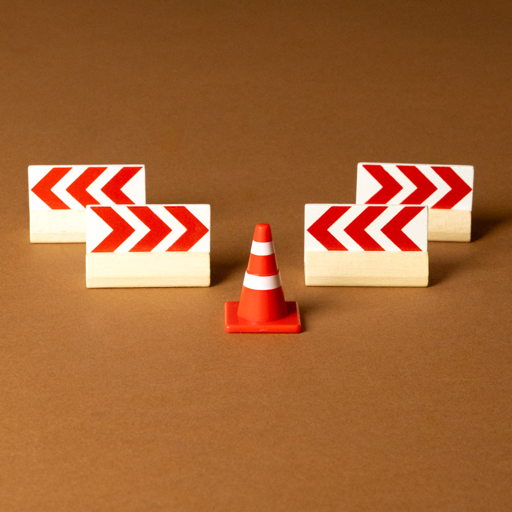 wooden-fire-engine-play-set Red and white striped traffic cone with construction signs on a brown background