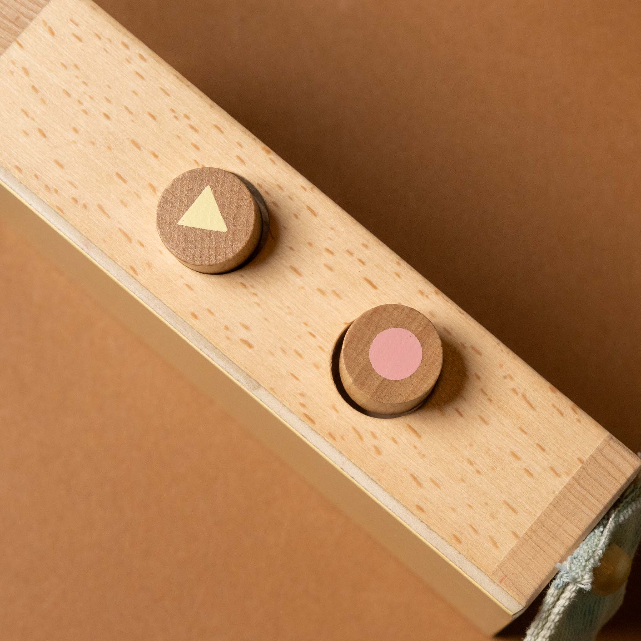 wooden-tape-recorder-with-purple-faceplate-buttons-for-play-and-stop