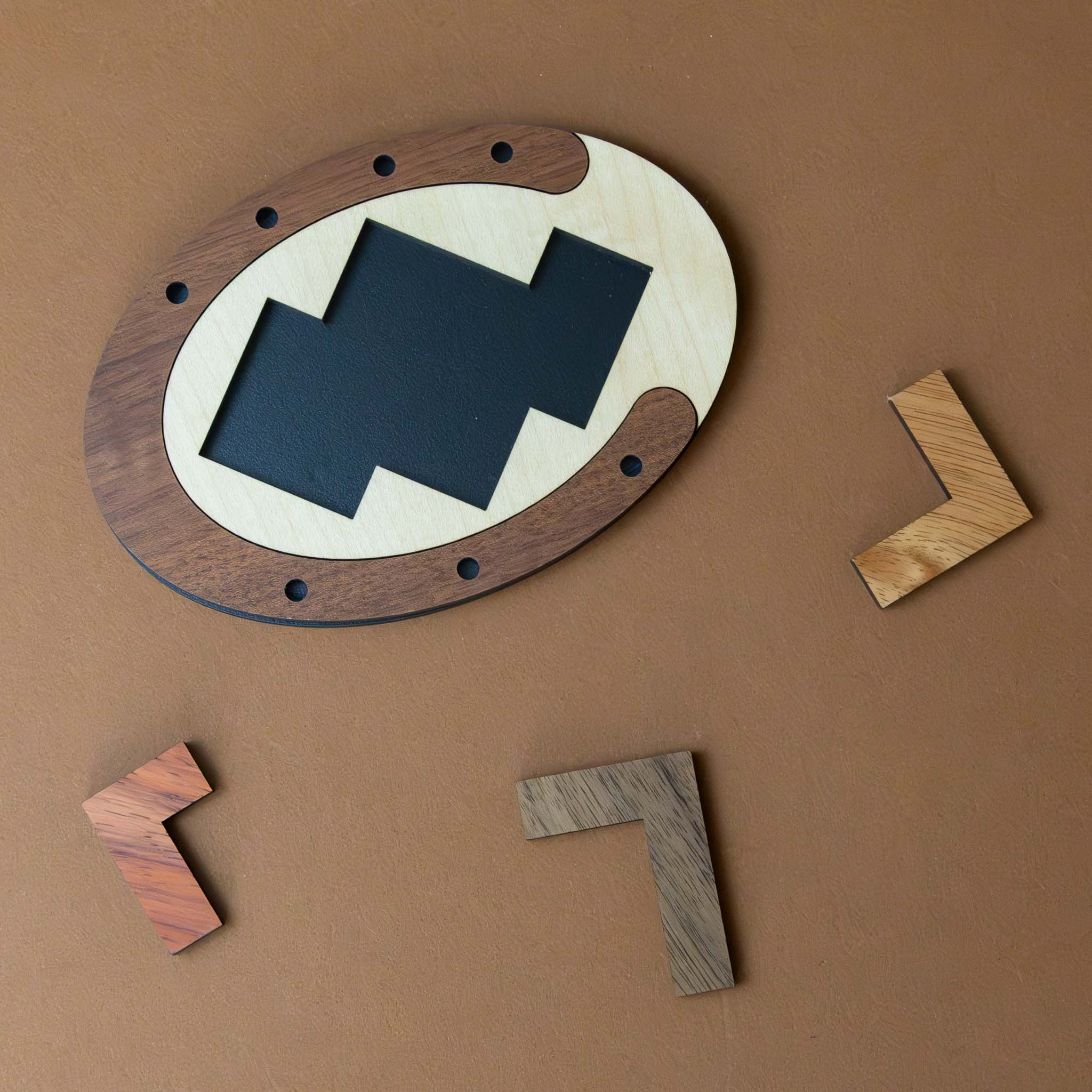 wooden-threes-company-puzzle-with-three-puzzle-pieces-that-fit-in-oval