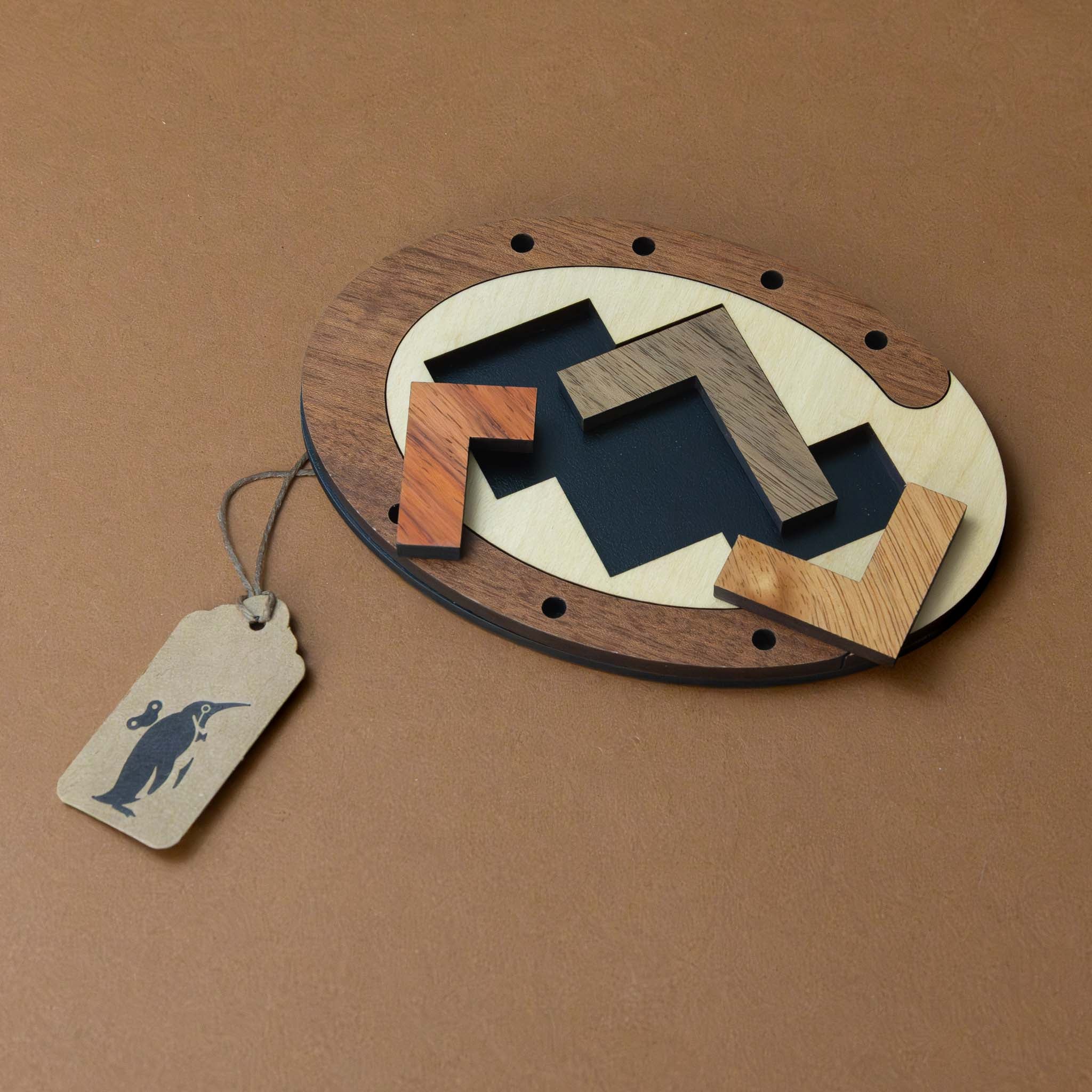wooden-threes-company-puzzle-with-three-puzzle-pieces-that-fit-in-oval