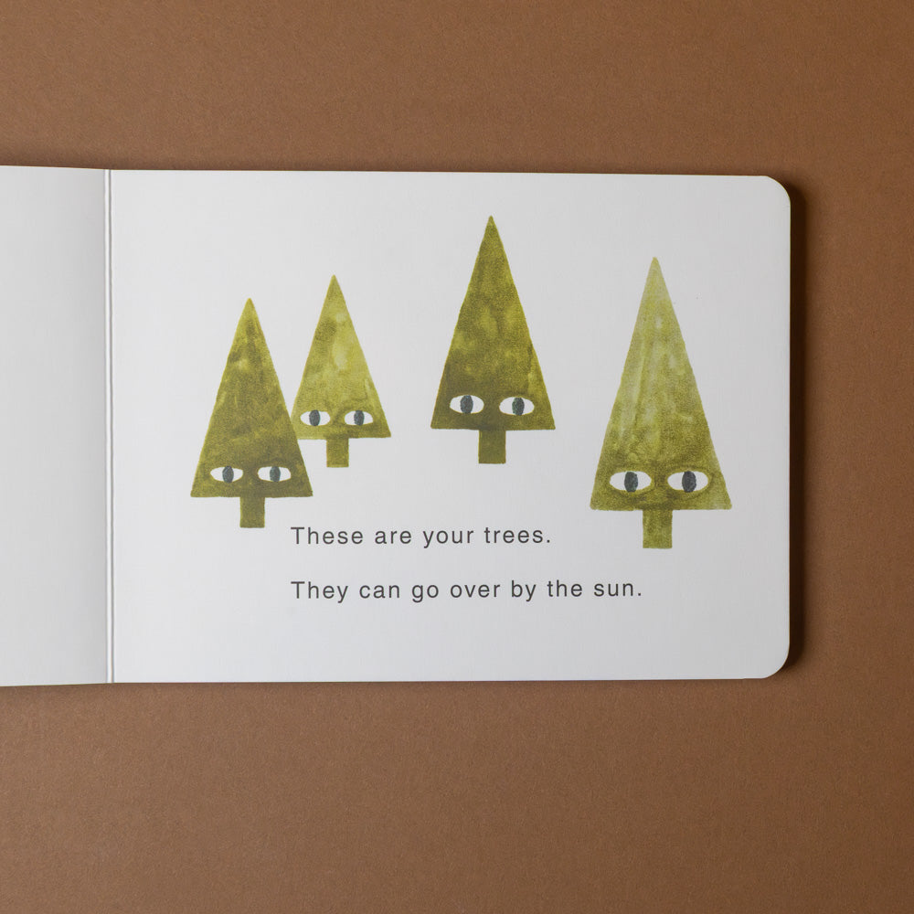 your-forest-board-book Open book with illustrations of trees and text on a brown background