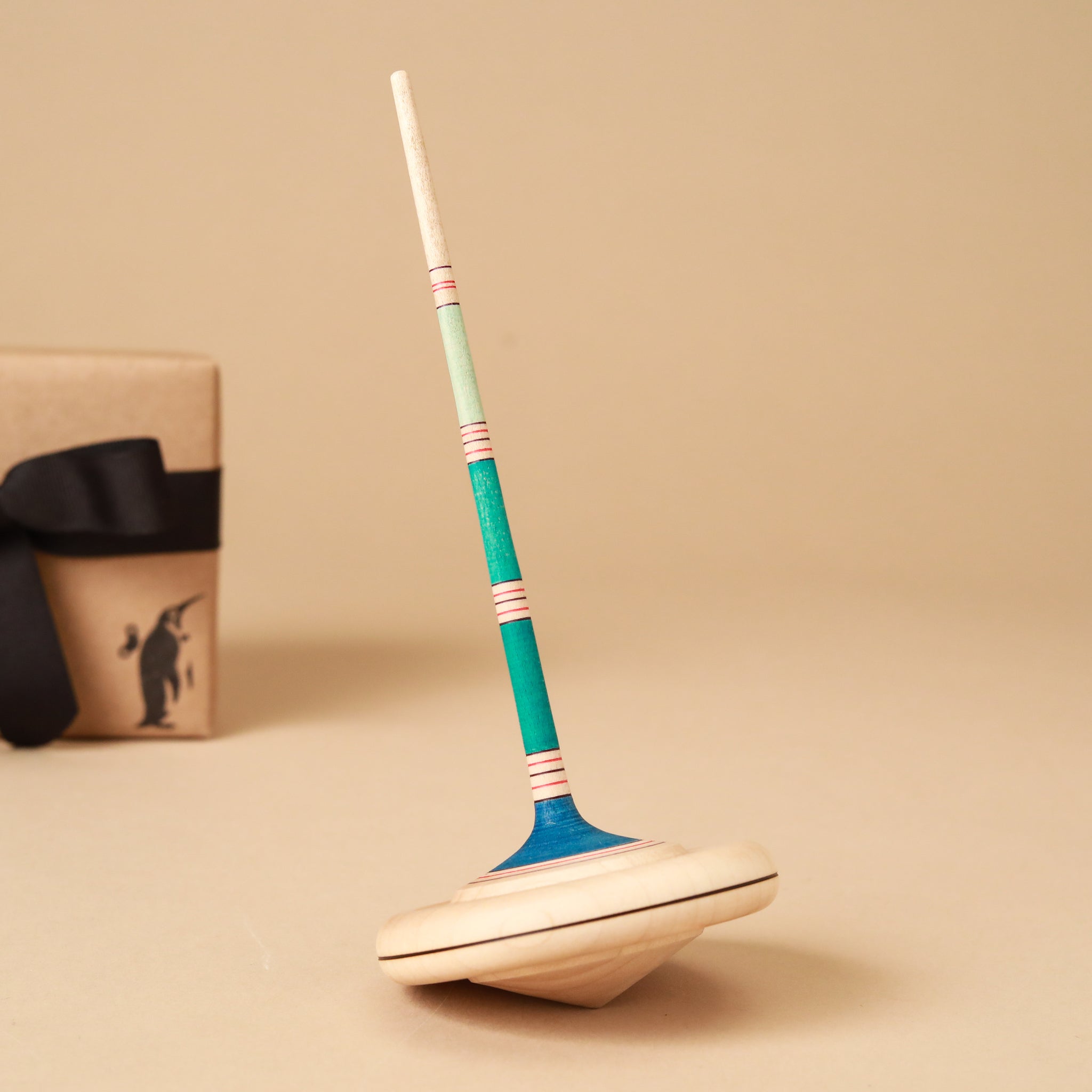 wooden-top-with-blue-striped-long-handle