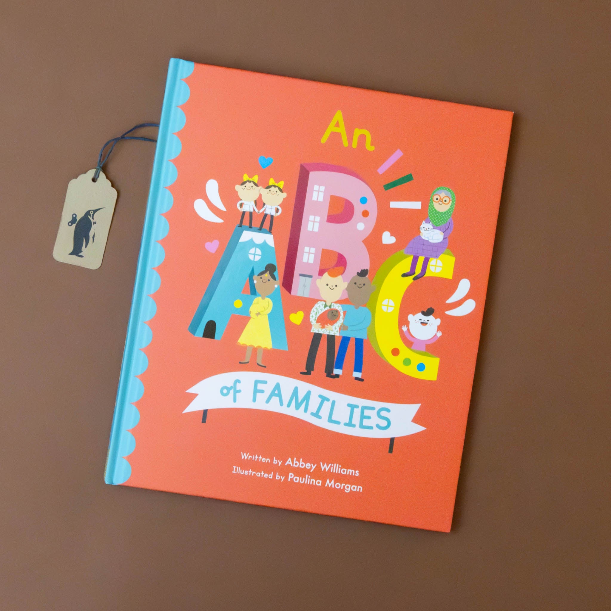 an-abc-of-families-book-red-cover-with-children-letters-and-families-illustrations