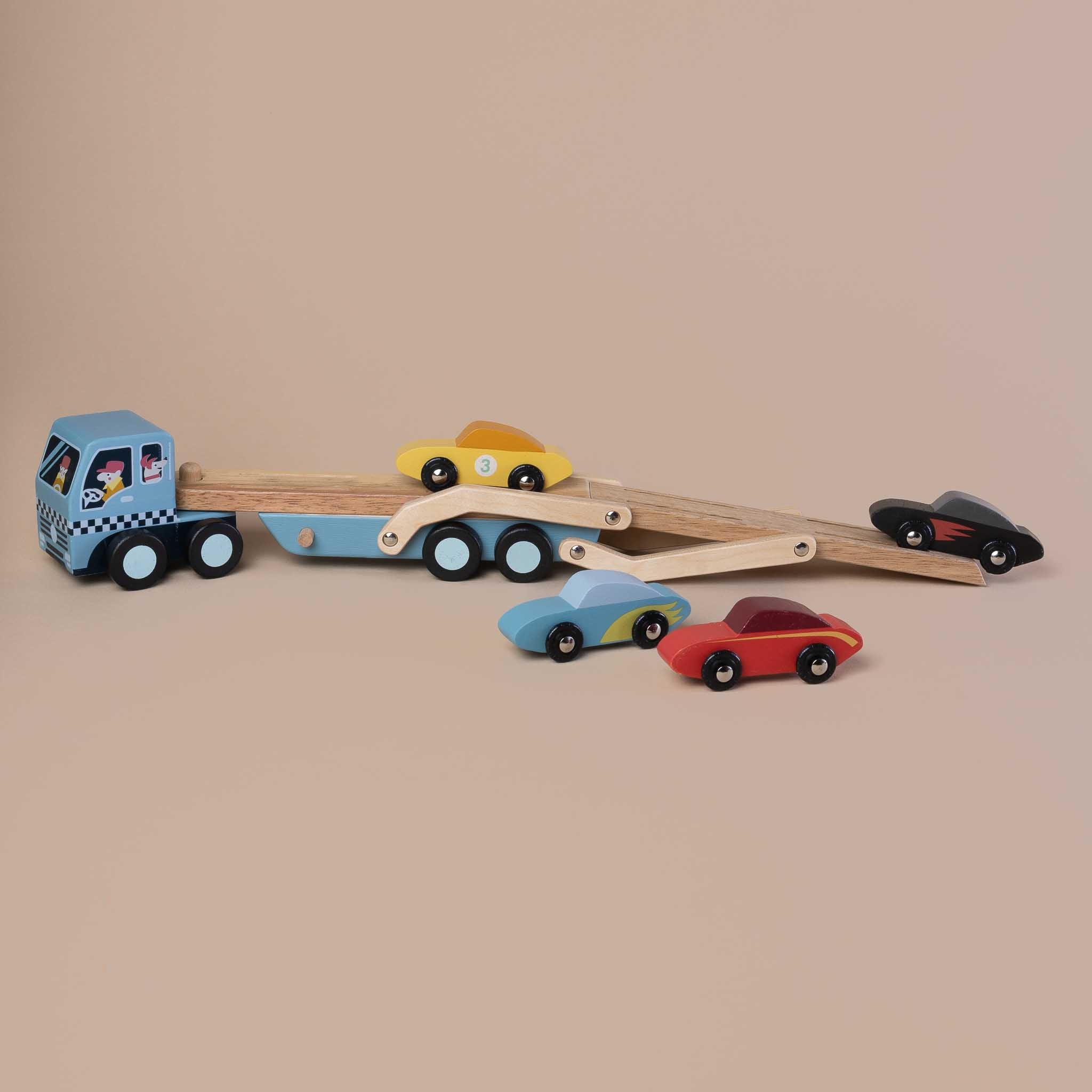 extended-transporter-with-two-cars-driving-up-the-ramp