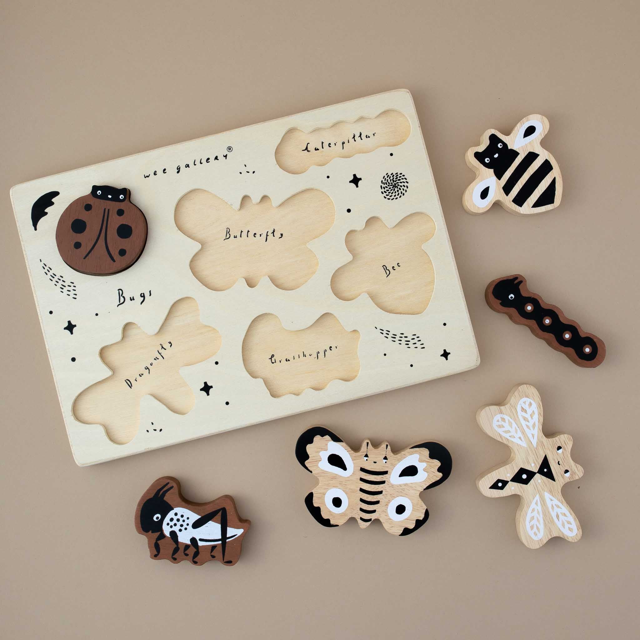 detail-of-wooden-board-without-bugs-showing-handwritten-names-of-the-animals