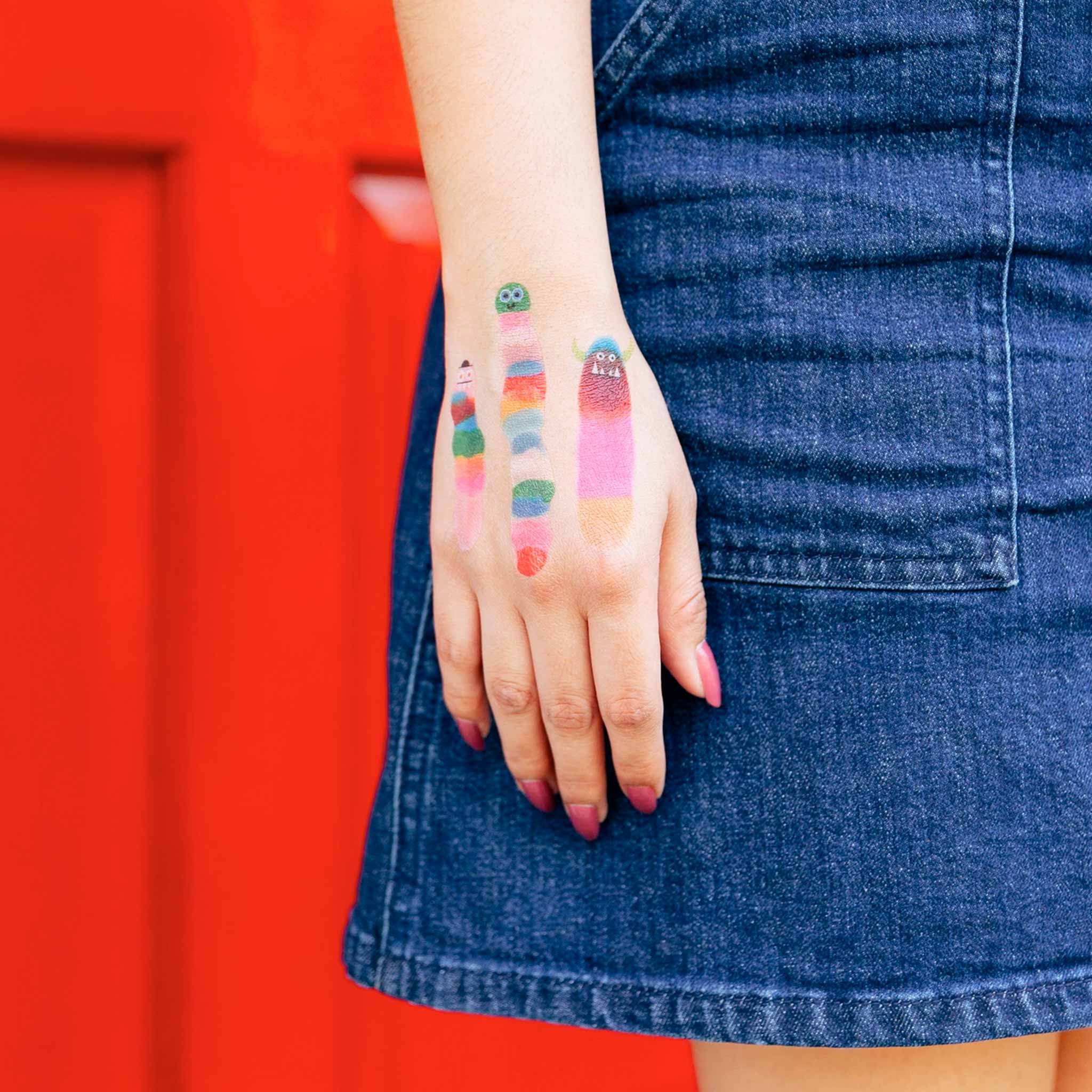 close-up-of-wormie-tattoos-on-light-skinned-model