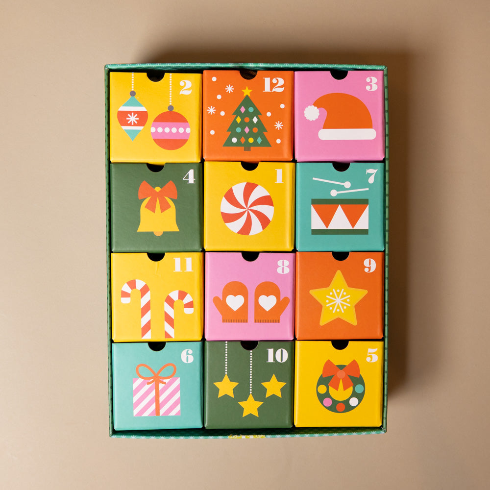Colorful 12-crafts-of-christmas-advent-calendar with Christmas-themed designs on a beige background