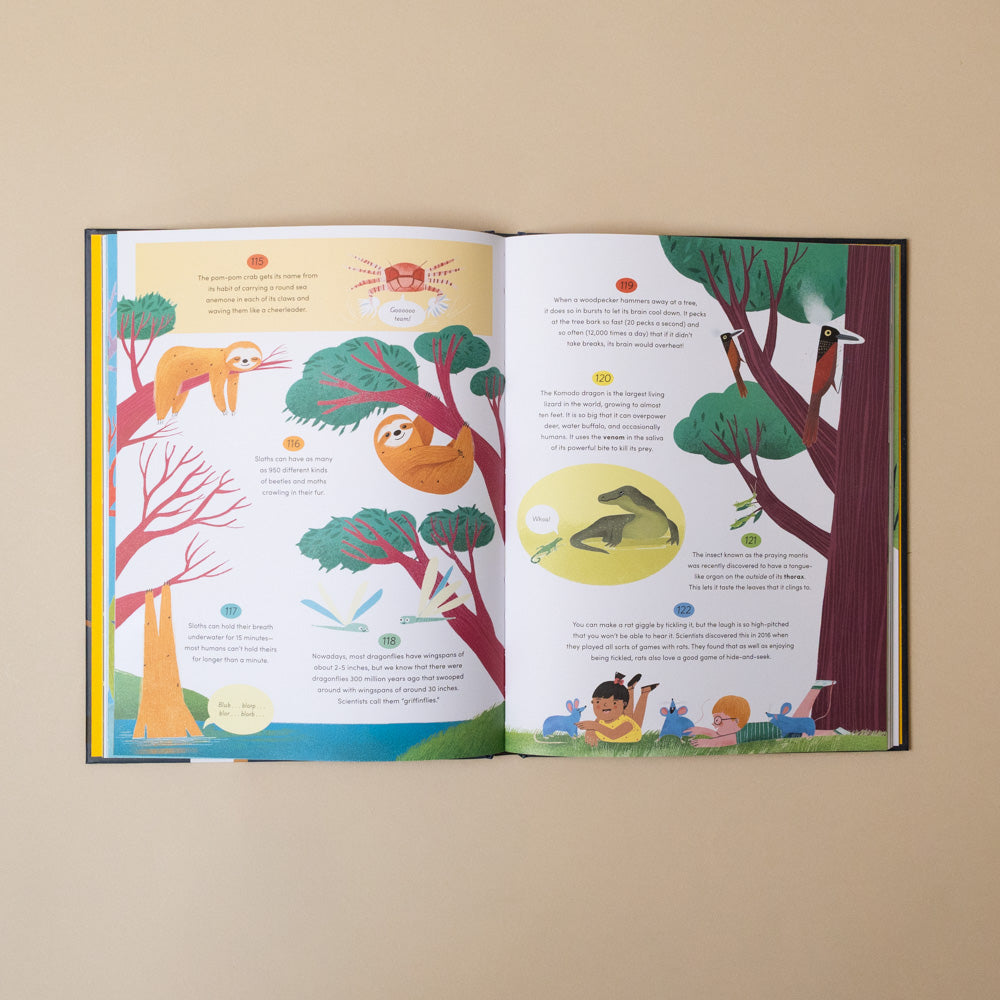 365-amazing-true-things-to-read-in-bed Open book with colorful illustrations of animals and nature on a beige background