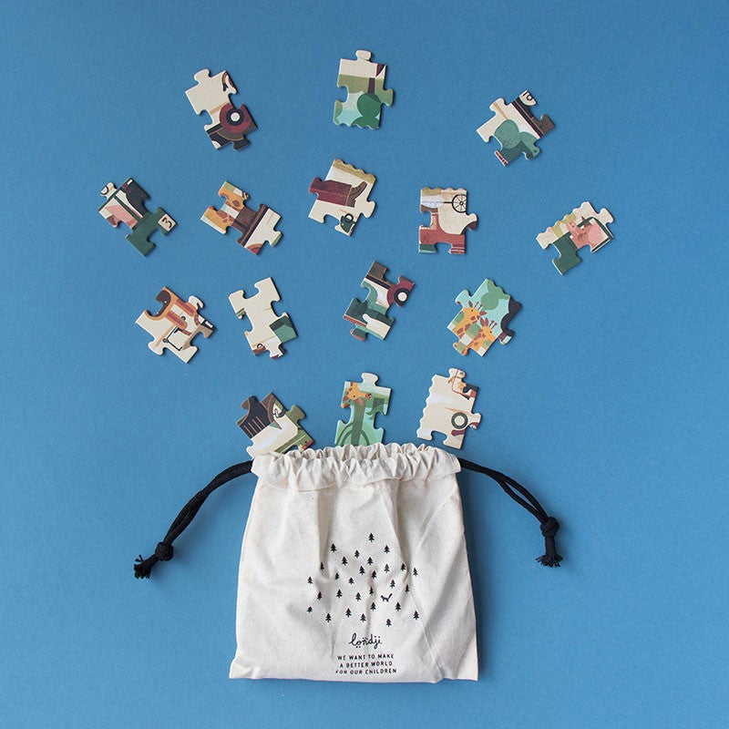 50-piece-pocket-puzzle-vroom-vroom50-piece-pocket-puzzle-vroom-vroom pieces in a drawstring bag on a blue background