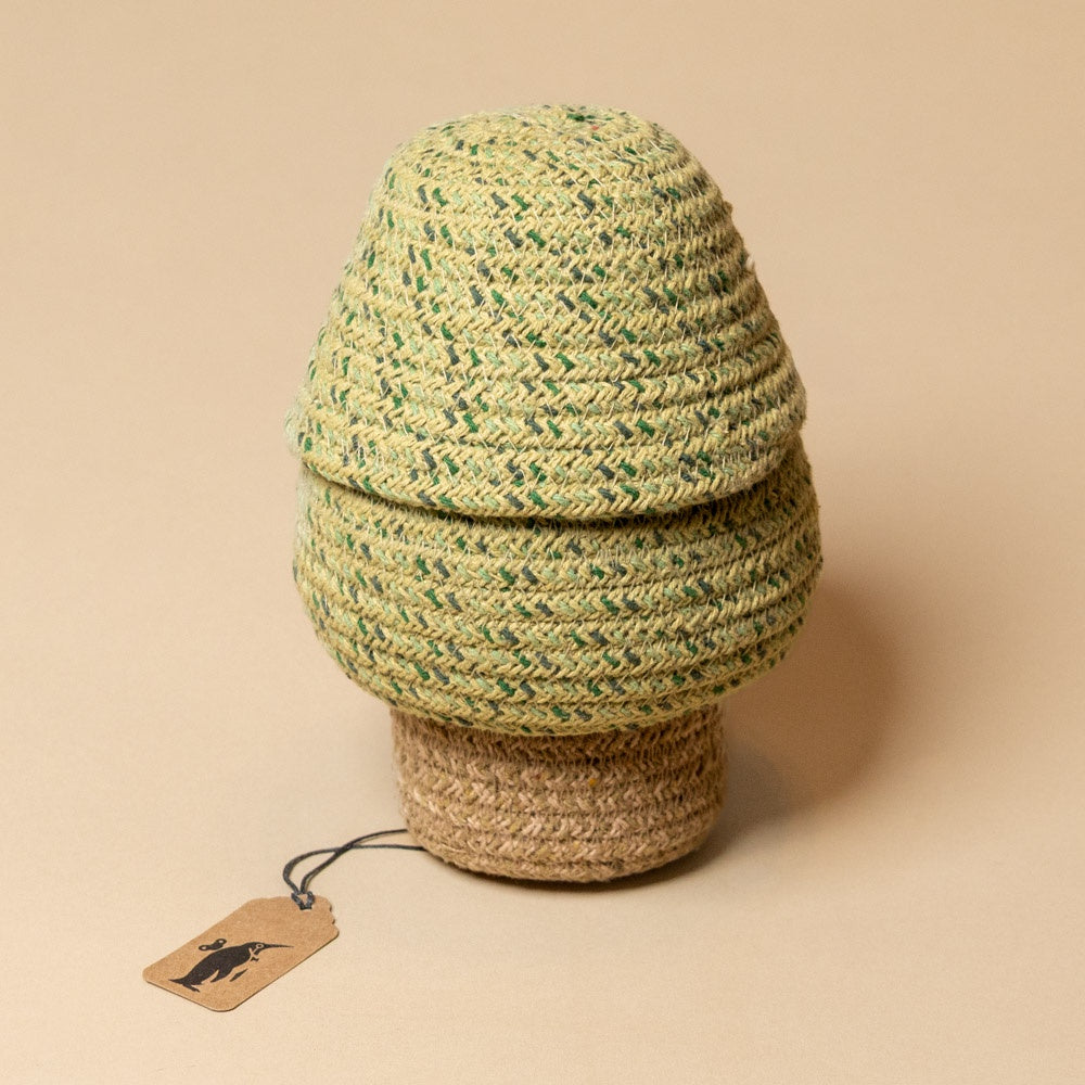 Tree-Basket---Small Woven basket with a tag on a beige background
