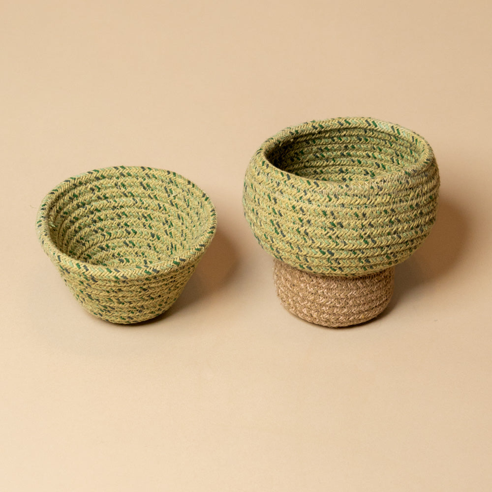 Tree-Basket---Small Two woven baskets with green and beige patterns on a beige background