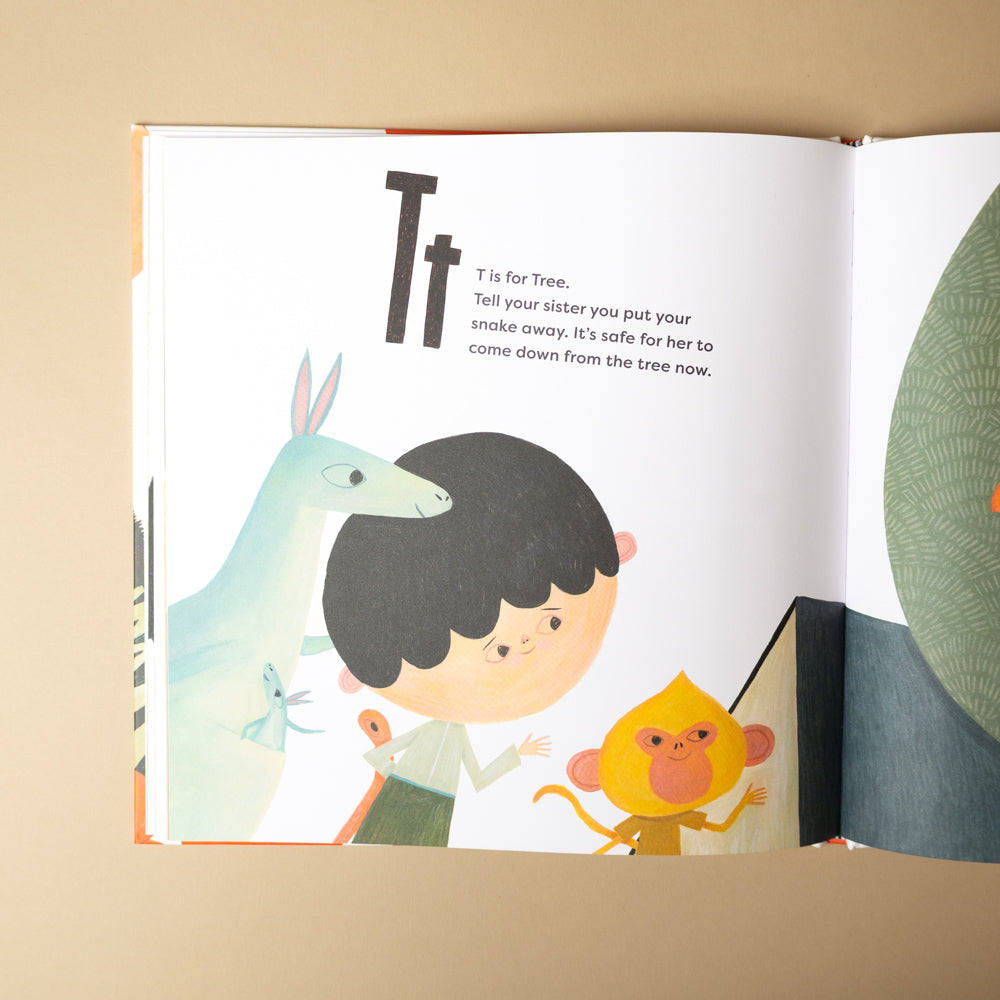 a-is-for-apple-unless Open book showing a page with illustrations of a child, a kangaroo, and a monkey, with text about the letter 'T'.