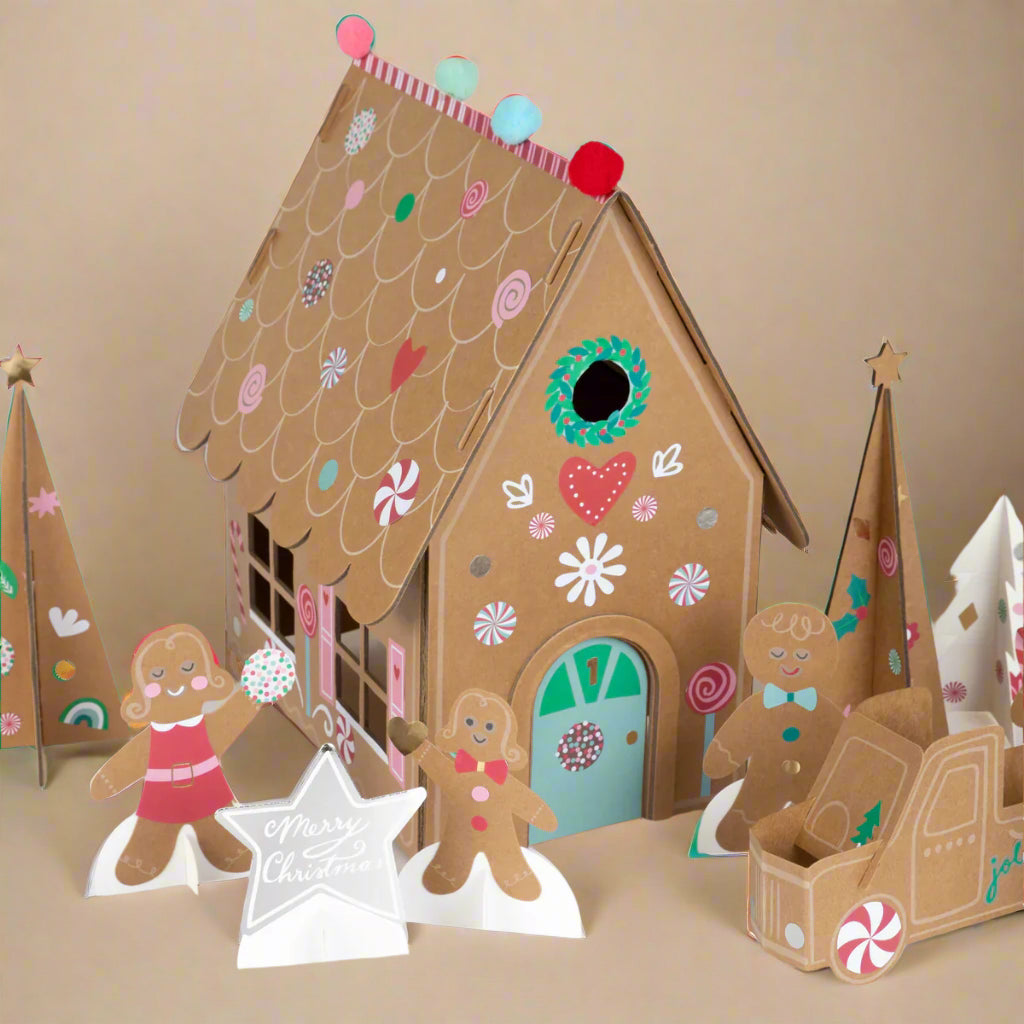 advent-calendar-play-kit-sticky-gingerbread-Cardboard gingerbread house with decorative elements on a beige background