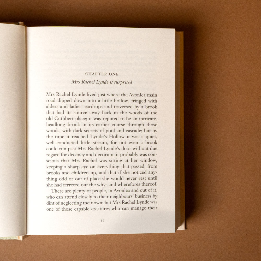 anne-of-green-gables titled chapter one Open book with text on a brown background