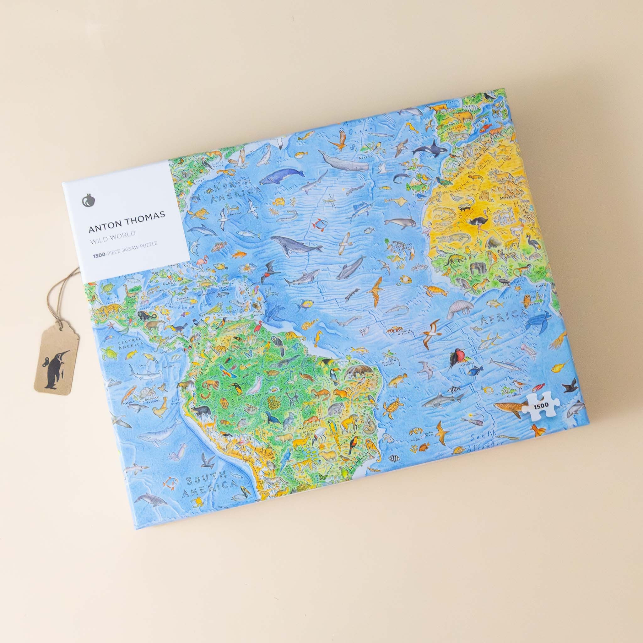 anton-thomas-1500-piece-wild-world-puzzle World map puzzle with animal illustrations on a beige background