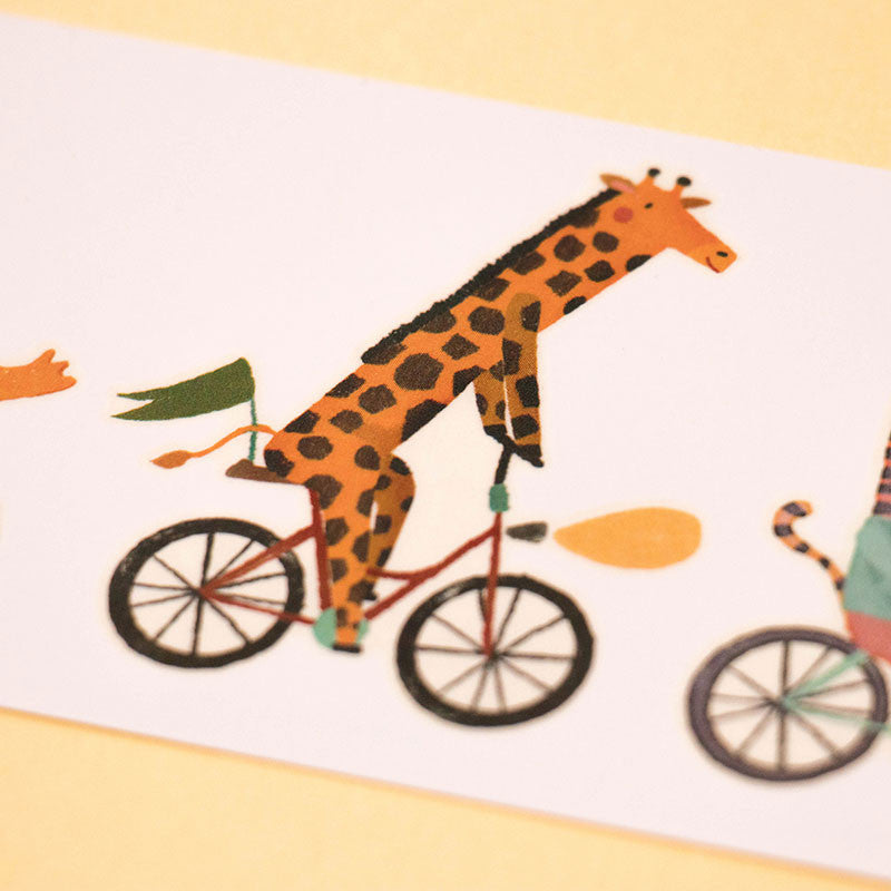 armful-of-tattoos-bikes-bicycling-giraffee