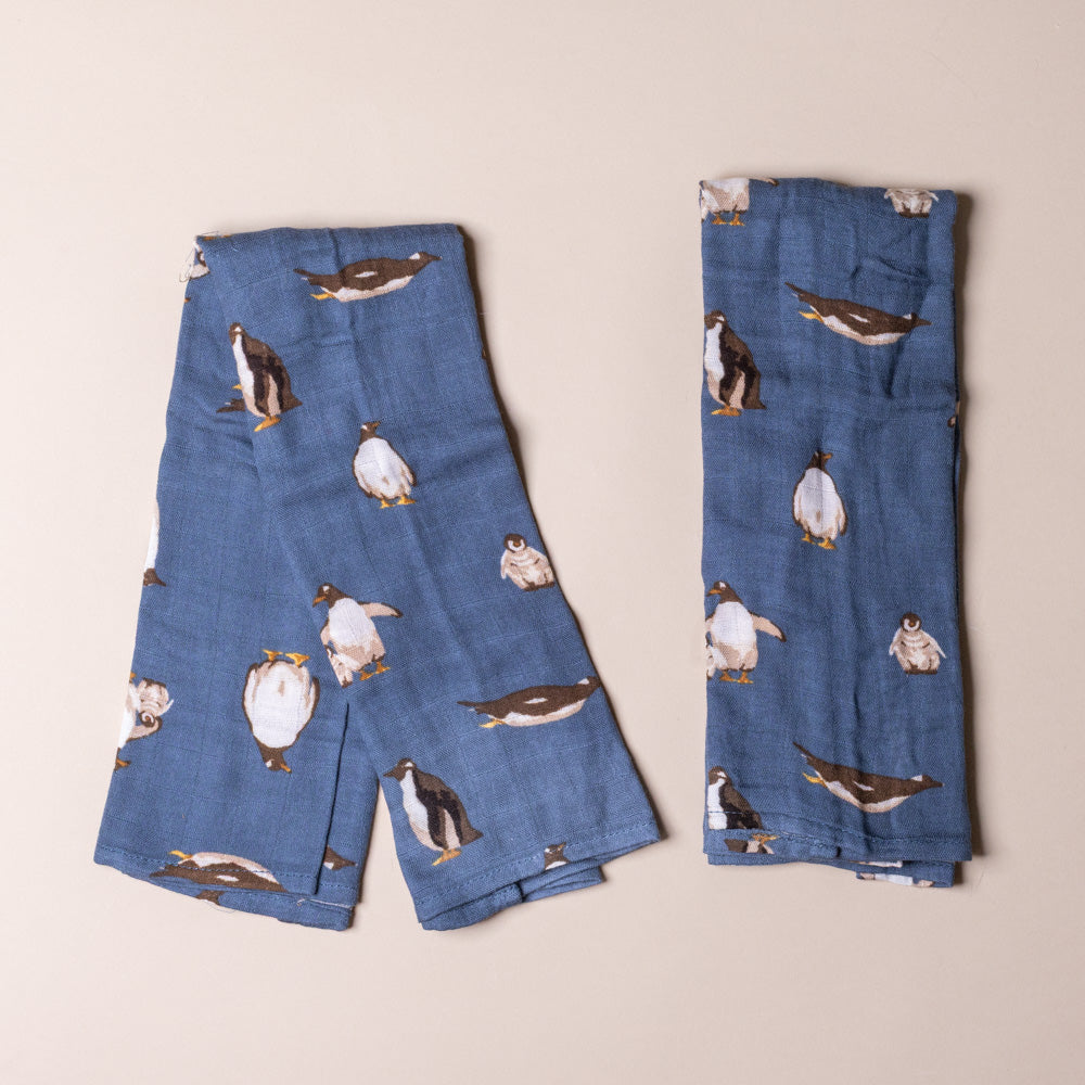 bamboo-burpie-set-penguins Blue with penguin pattern on a beige background