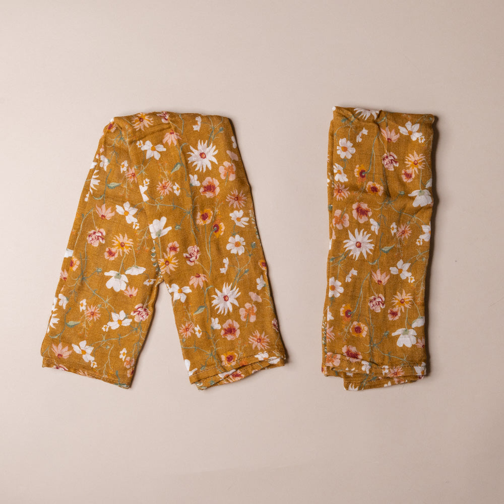 bamboo-burpie-set-wildflowers Floral-patterned pants on a beige background