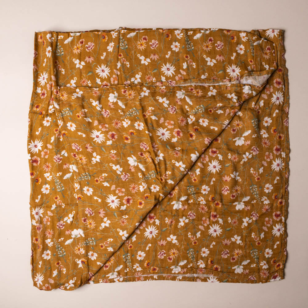 Floral patterned bamboo-swaddle-wildflower on a plain background
