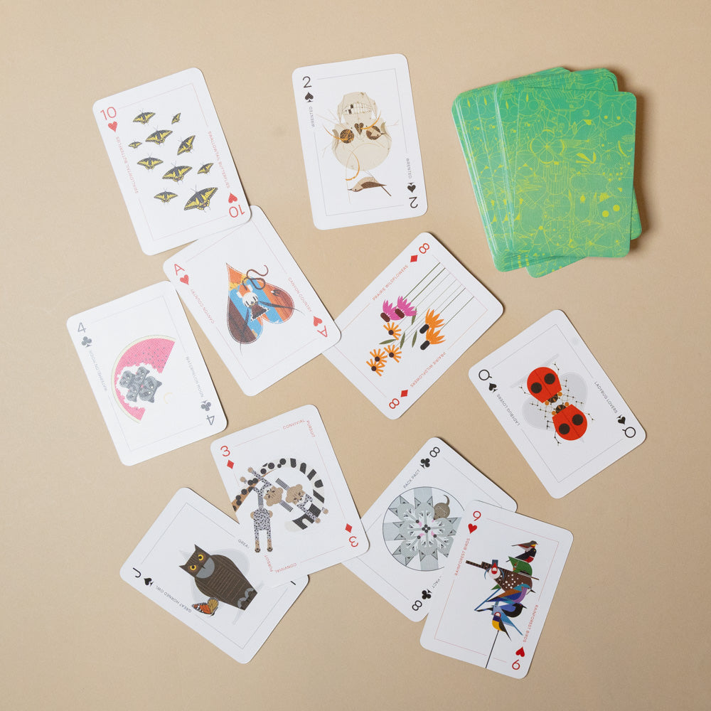 charley-harper- Set of playing cards with animal illustrations on a beige background