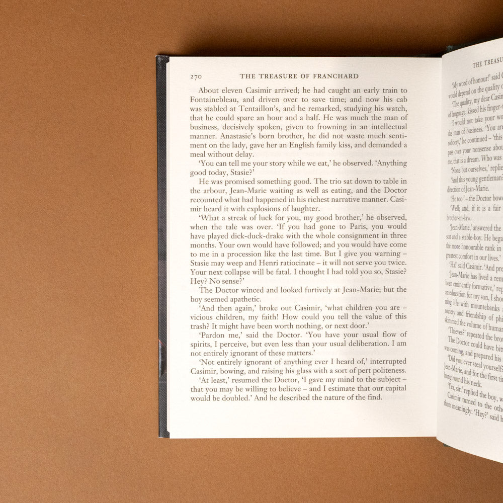 dr-jekyll-and-mr-hyde Open book on a brown surface with text visible