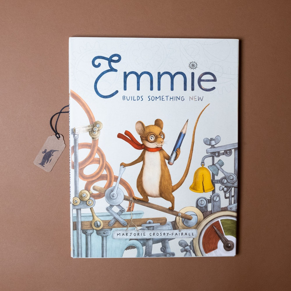 Book cover of 'Emmie Builds Something New' with a mouse character on a brown background
