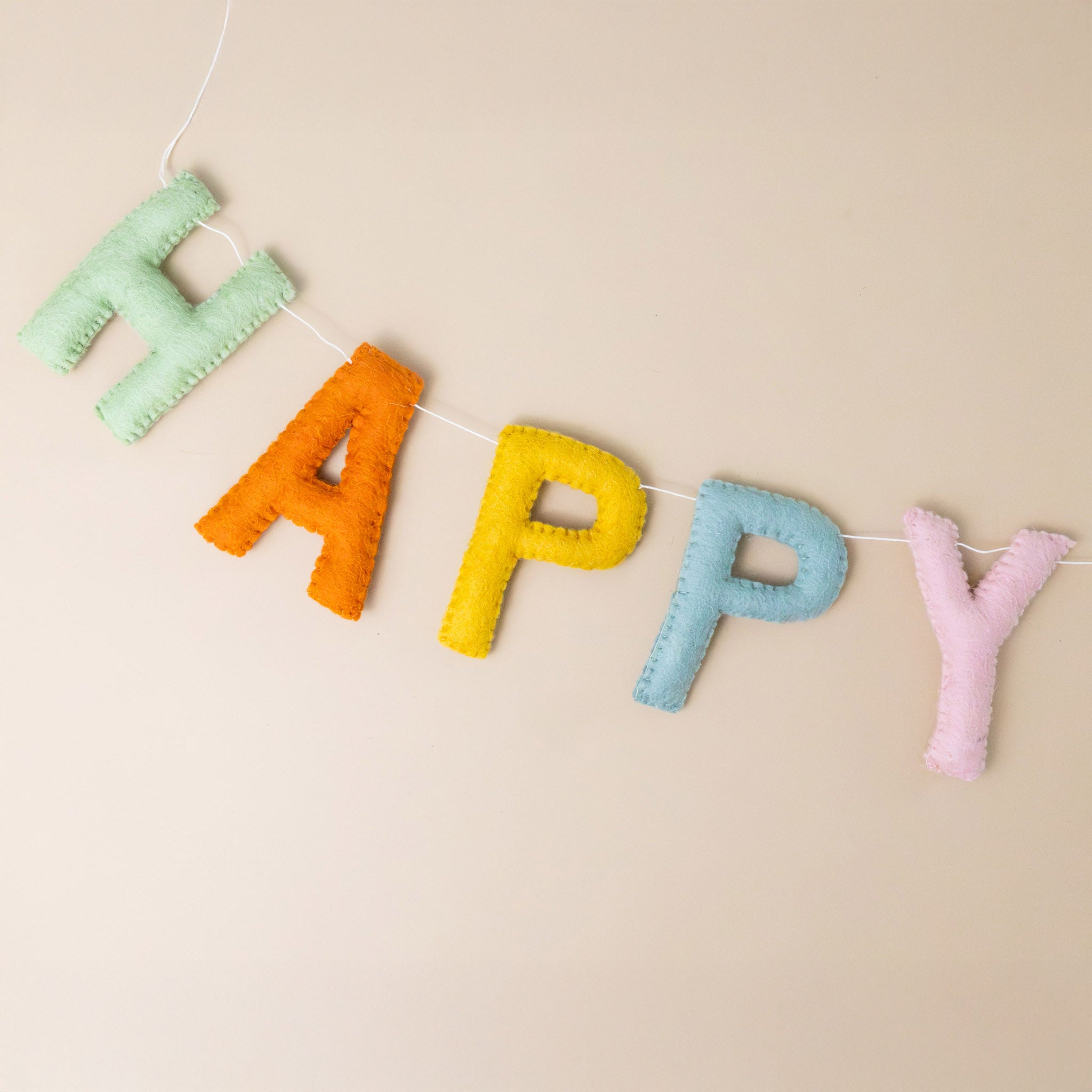 felted-happy-birthday-garland-muted-rainbow-colored