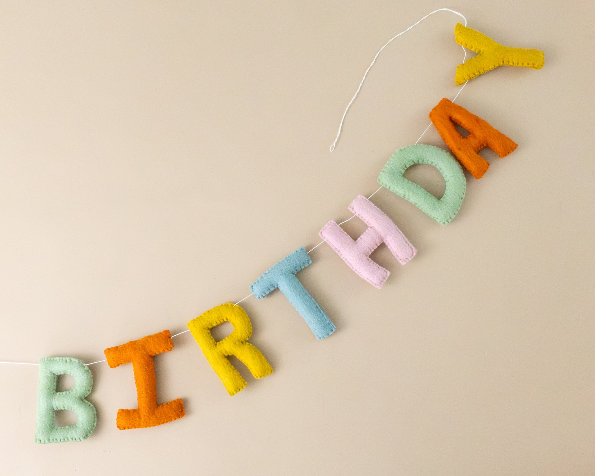 felted-happy-birthday-garland-muted-rainbow-colored