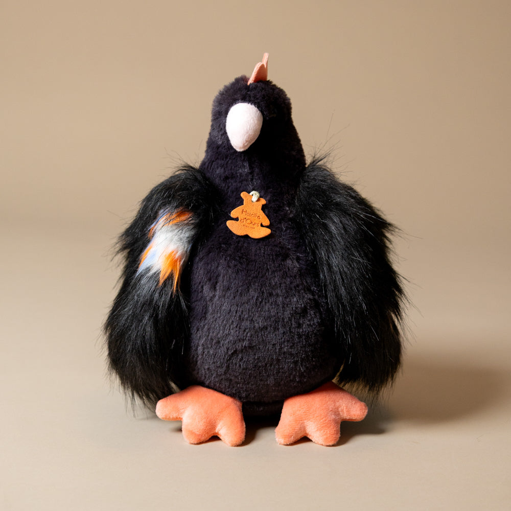 Plush toy floofy-chicken-black  on a beige background