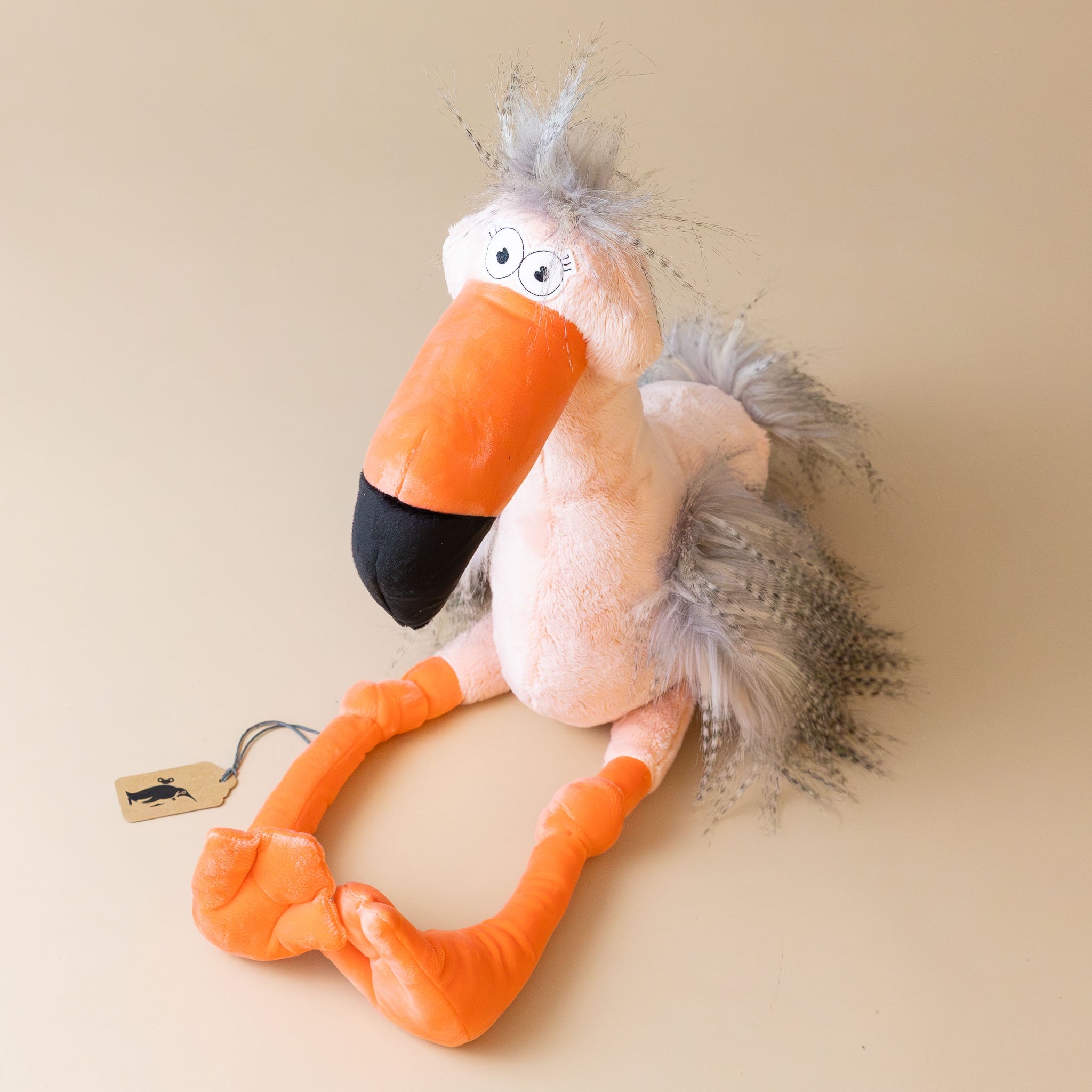 fool-flamingo-with-salmon-body-orange-beak-and-legs-and-grey-tufts