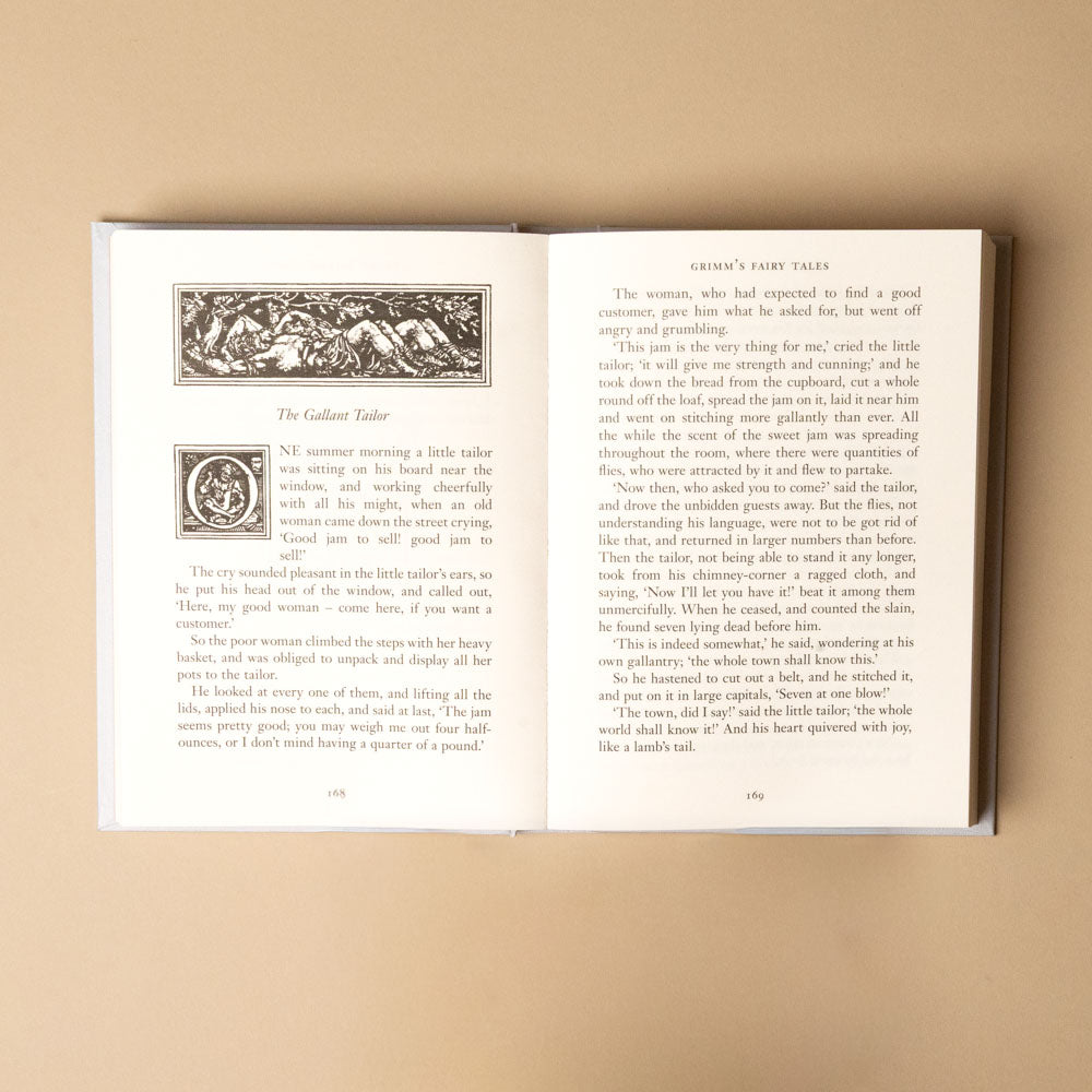 grimms-fairy-tales Open book with text and illustrations on a beige background