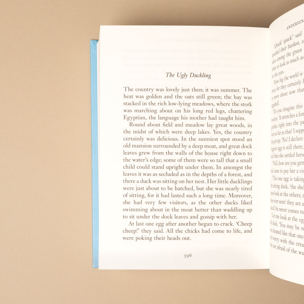 hans-christian-andersen-fairy-tales Open book titled the ugly duckling with text on a beige background
