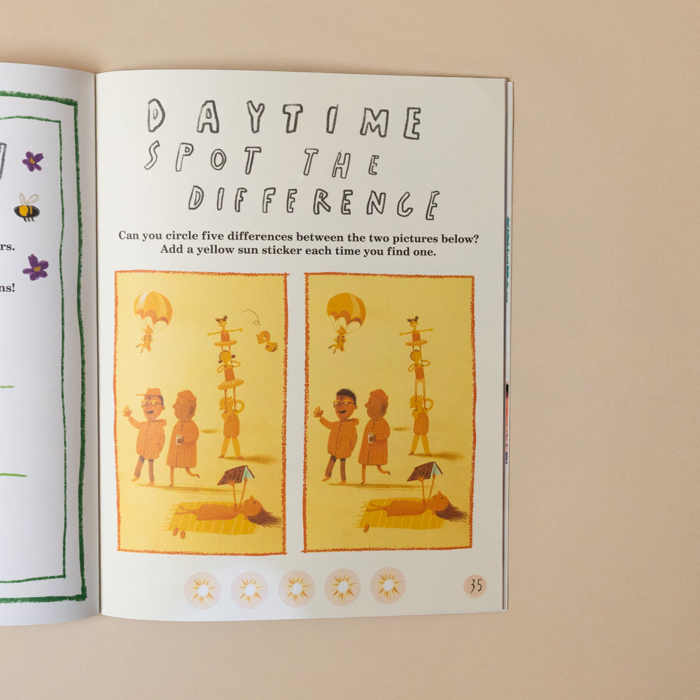 here-we-are-activity-book Open book with a 'Spot the Difference' activity on a beige background