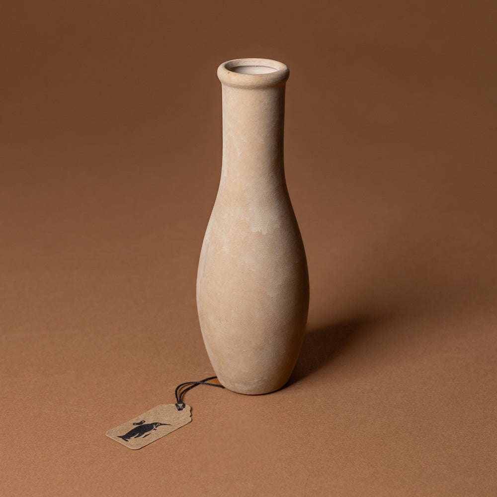 holden-bud-vase-large Beige ceramic vase on a brown background with a tag attached.