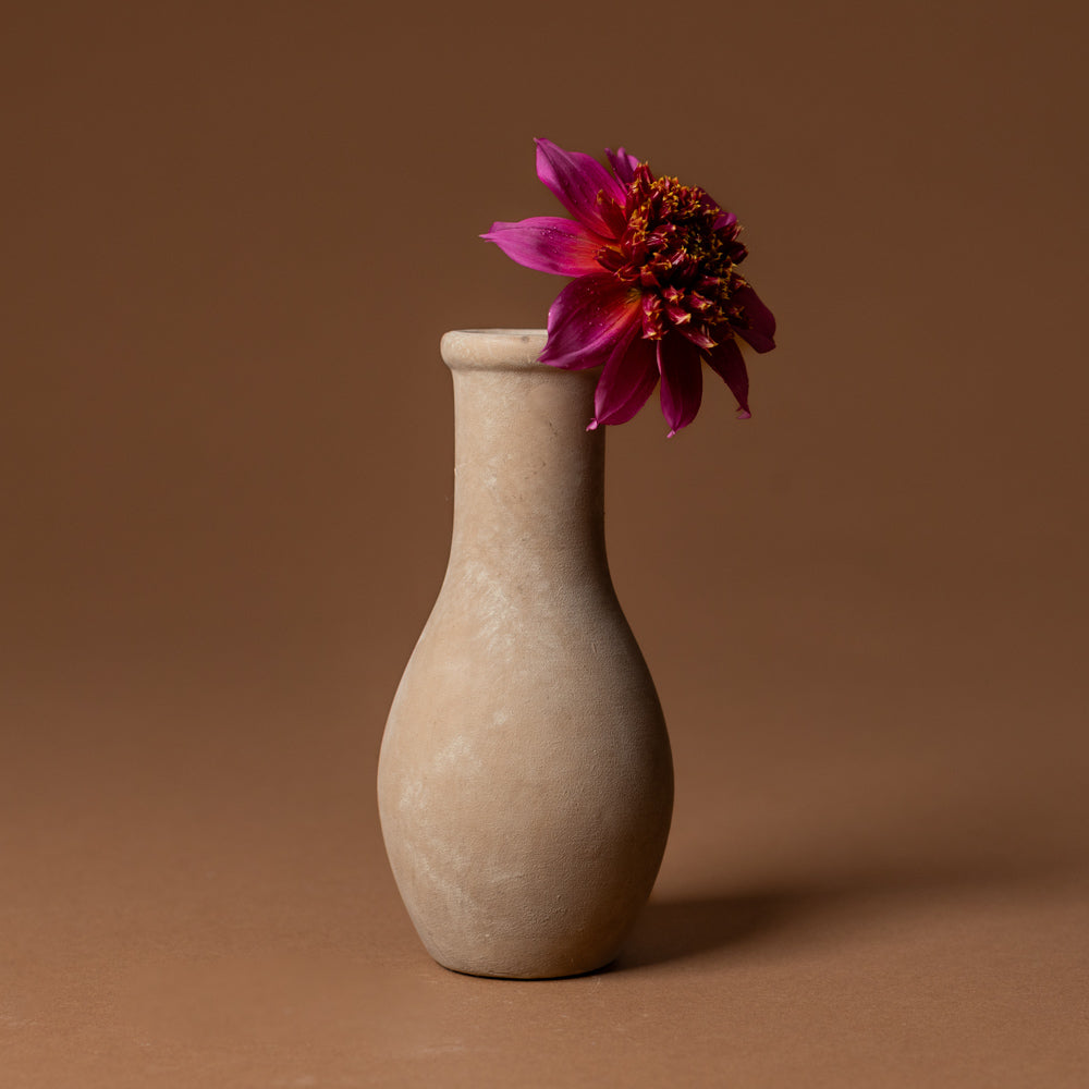 holden-bud-vase-medium Beige vase with a pink flower on a brown background