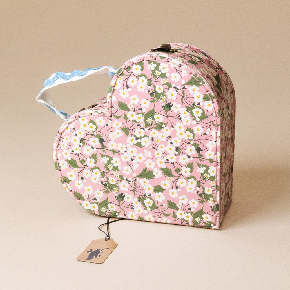 liberty-heart-suitcase-small floral with a tag on a beige background