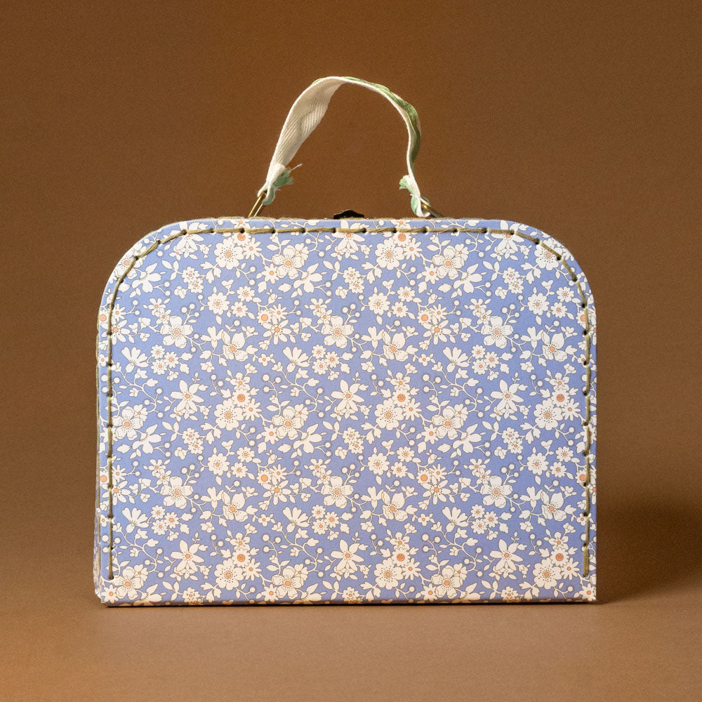 liberty-suitcase-small Floral-patterned fabric suitcase on a brown background